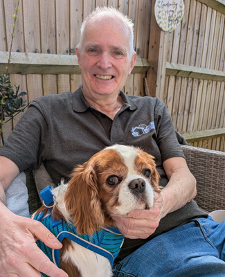 Steve Gunn from PHG Droitwich Spa sitting with a dog